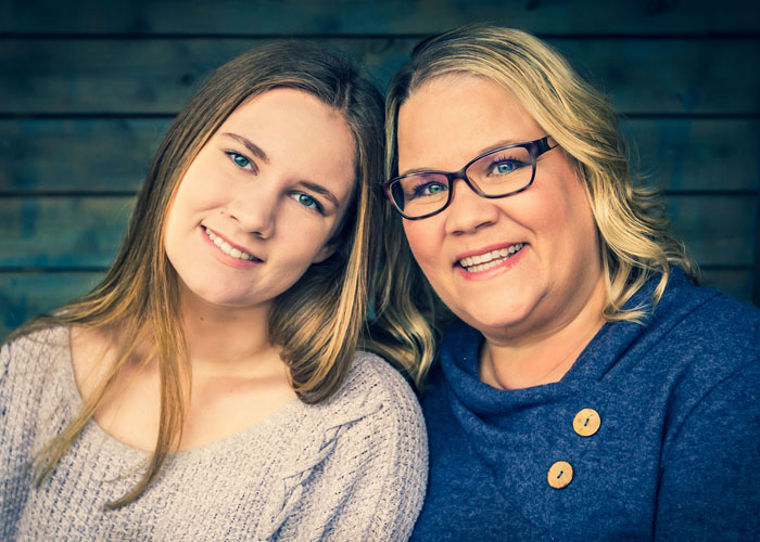 Mother and daughter pose for portraits